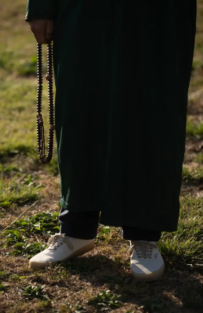 San Diego, CA – Ron Valdez holds beads of remembrance...