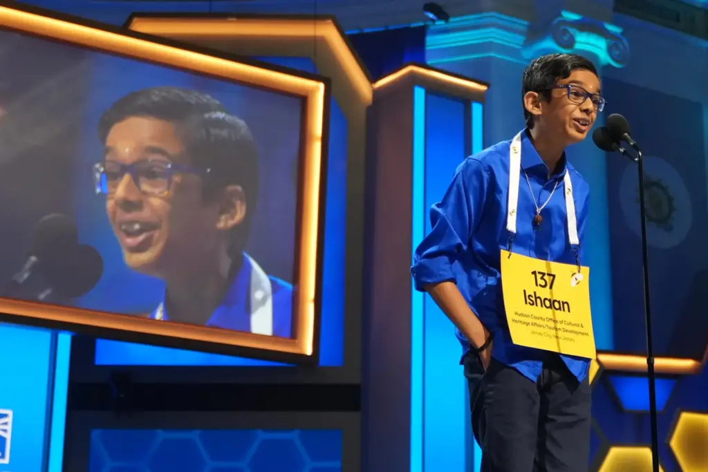 Ishaan Gupta spells his word during the final round of the 2026 Scripps National Spelling Bee.