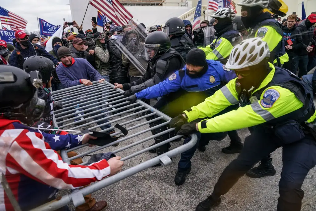 Trump supporters try to break through a police barrier, Jan. 6, 2021, at the Capitol