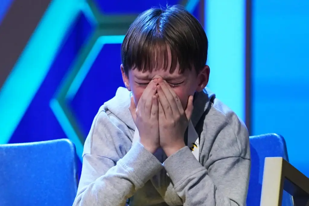 Logan Bailey reacts during the final round of the 2026 Scripps National Spelling Bee.