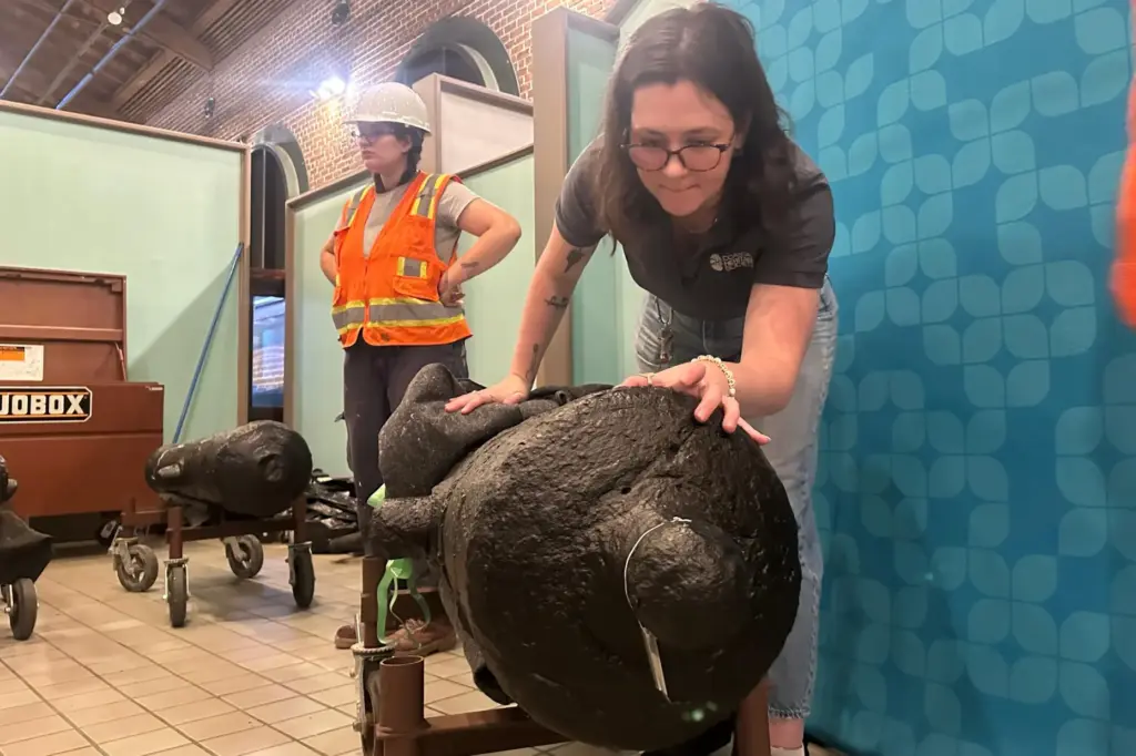 Samantha Moss inspects a cannon, which sunk to the bottom...