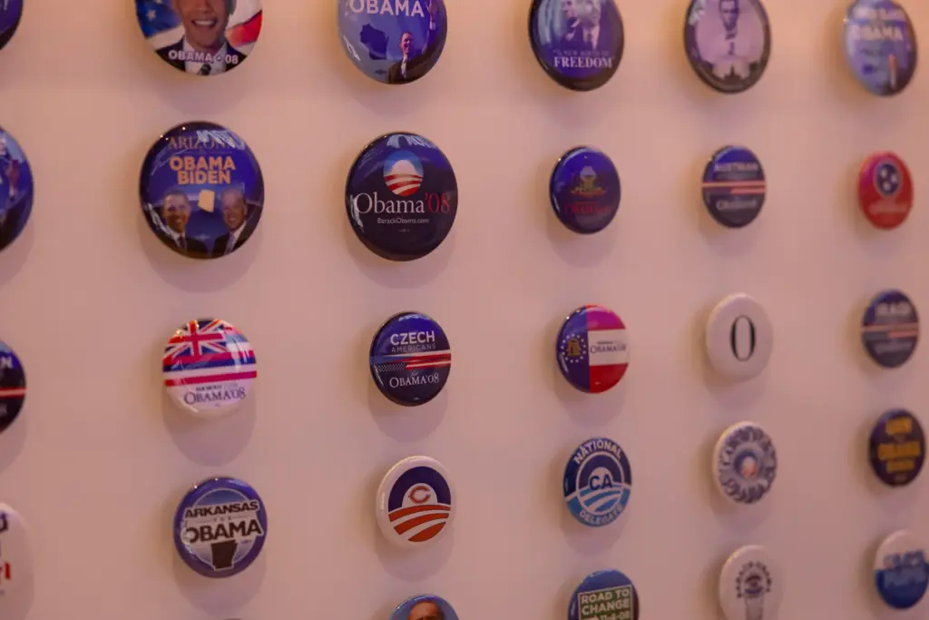 Campaign buttons from 2008 are displayed as the Obama Presidential...