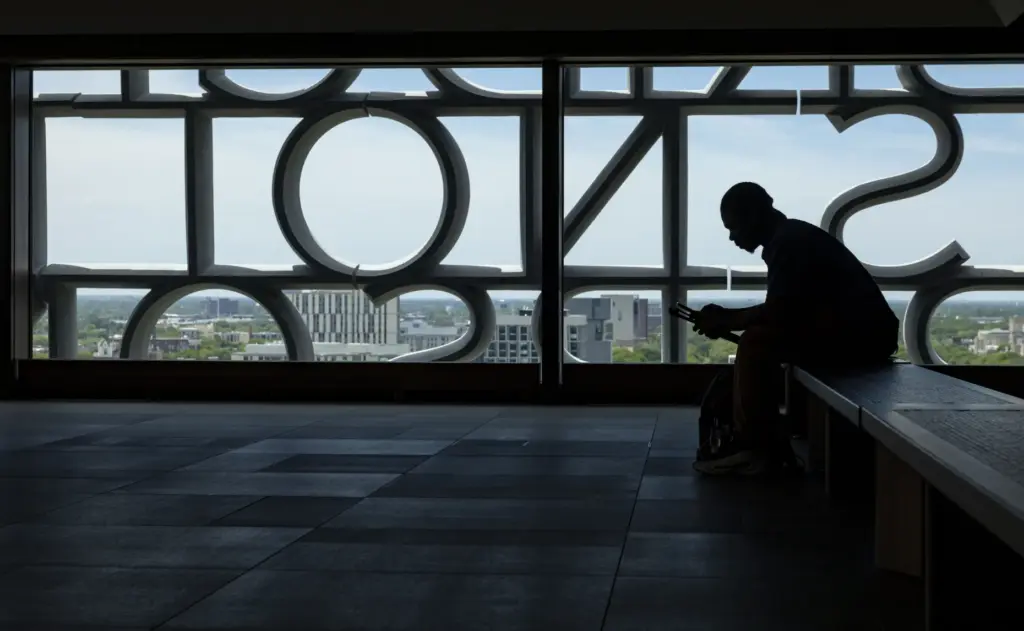 A visitor sits in the Sky Room as the Obama...