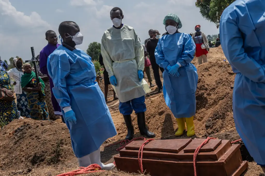 Red Cross workers prepare to bury Vanisa Anifa, a 6-month-old...