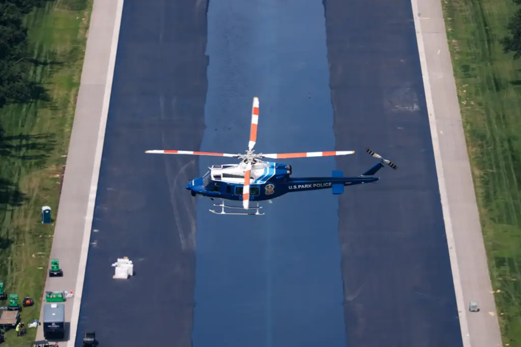 A U.S. Park Police helicopter flies over the Lincoln Memorial...