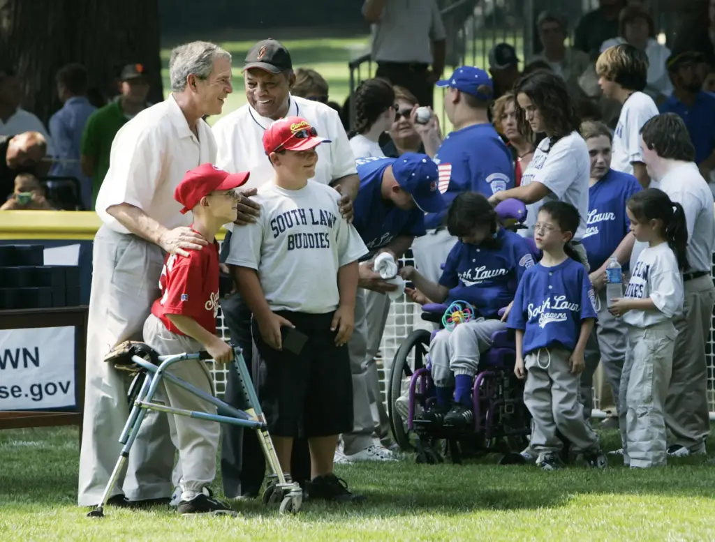 FILE – President George W. Bush, left, and National Baseball...