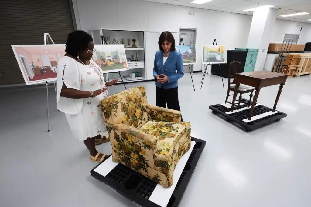 FILE – Amber N. Mitchell, Curator of Black History, left,...
