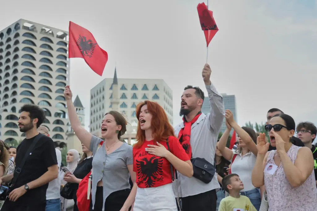 Protesters wave Albanian flags during demonstration in Tirana, Albania, Wednesday,...