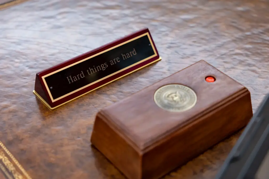 A sign is visible on a replica of the Resolute...