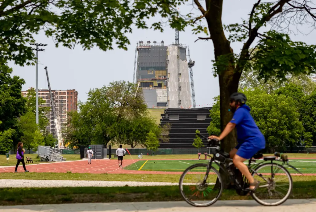 The tower rises behind athletic fields in Jackson Park as...