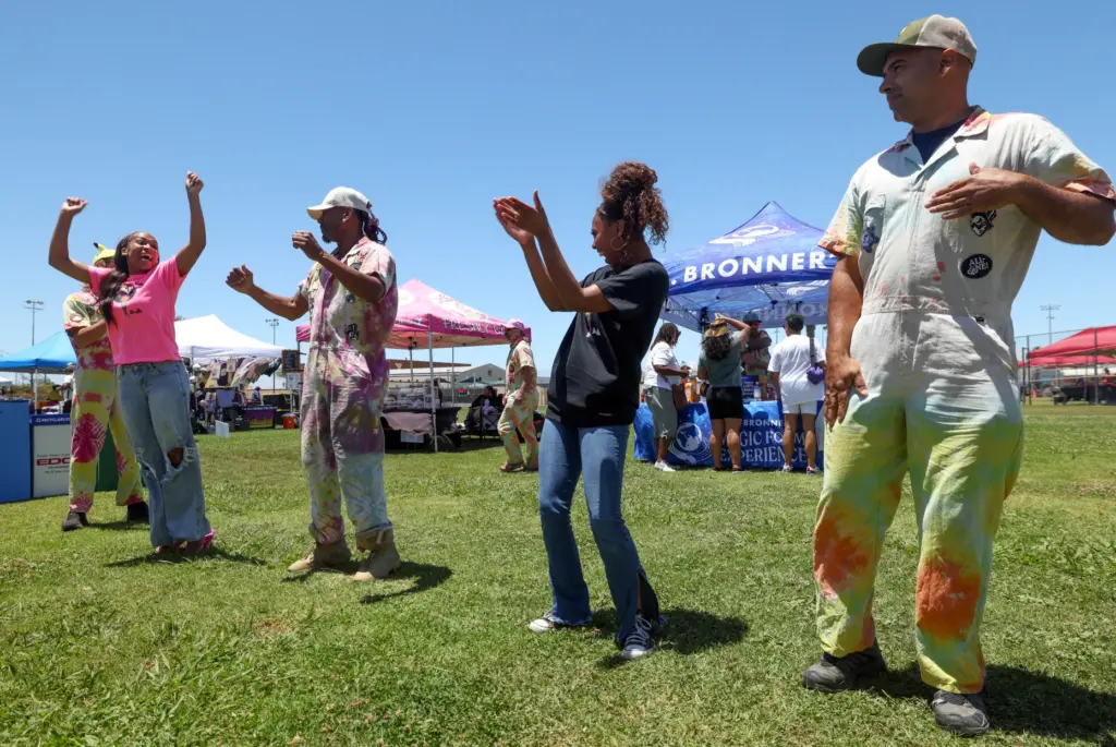Participants in an impromptu dance lesson by T Love, center...