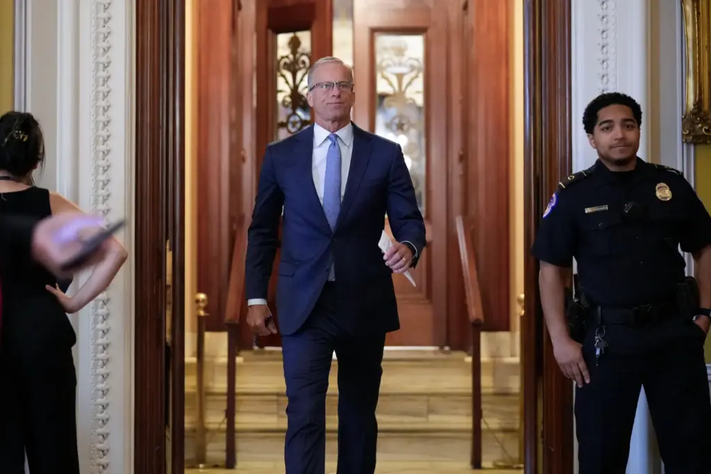 Senate Majority Leader John Thune, R-S.D., leaves the chamber, at...