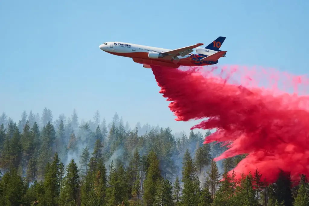 Fire retardant is dropped by air tanker onto the Upriver...