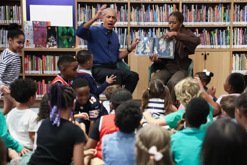 Former President Barack Obama, left, and former first lady Michelle...