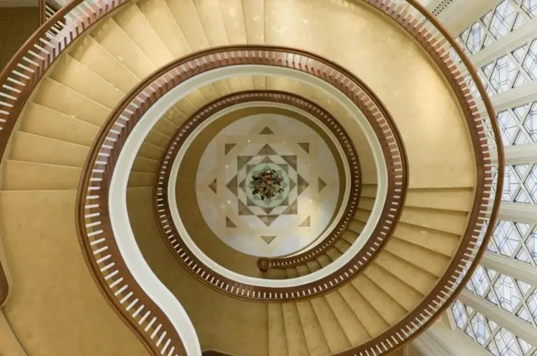View looking down the towering staircase that goes up four...