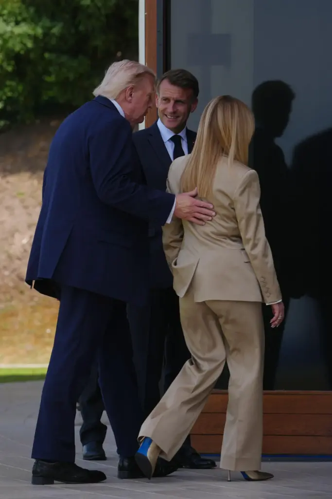 U.S. President Donald Trump, left, speaks with French President Emmanuel...