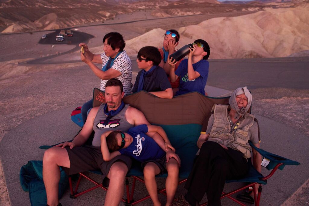 People watch the sunset in the heat at Zabriskie Point in Death Valley National Park.