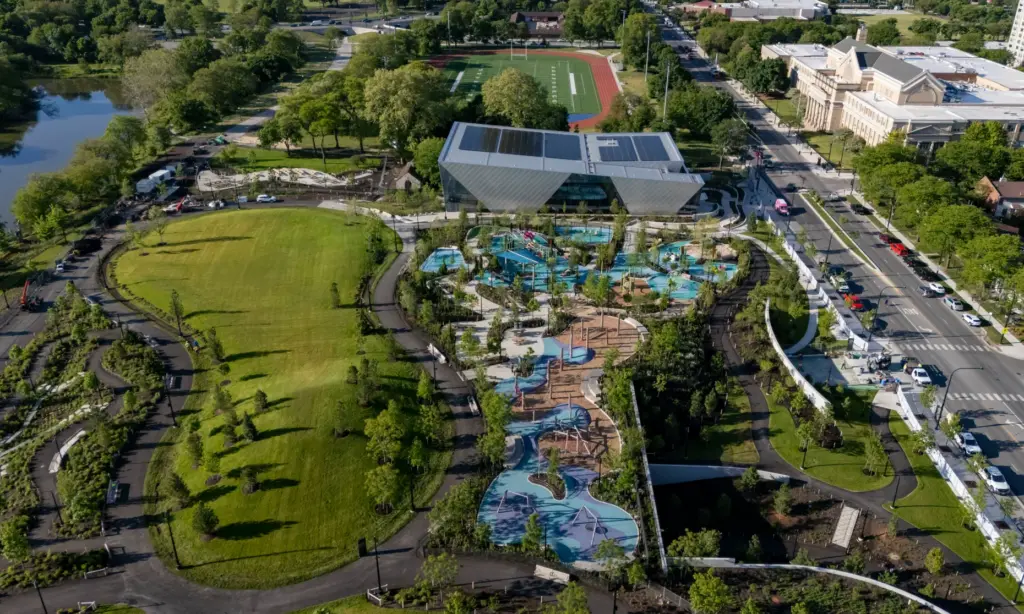 The great lawn and playground on the campus of the...