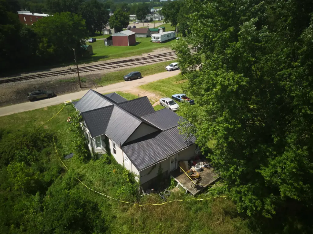 Police tape surrounds a home where authorities say they removed...