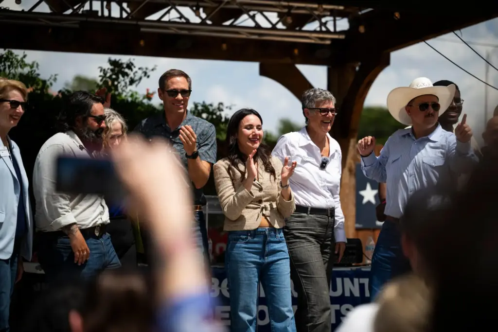 Democratic candidate for Texas governor Gina Hinojosa, center, stands on...