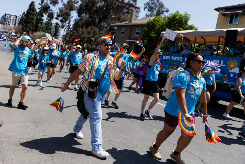 Participants walk toward Balboa Park through Sixth Avenue during the...