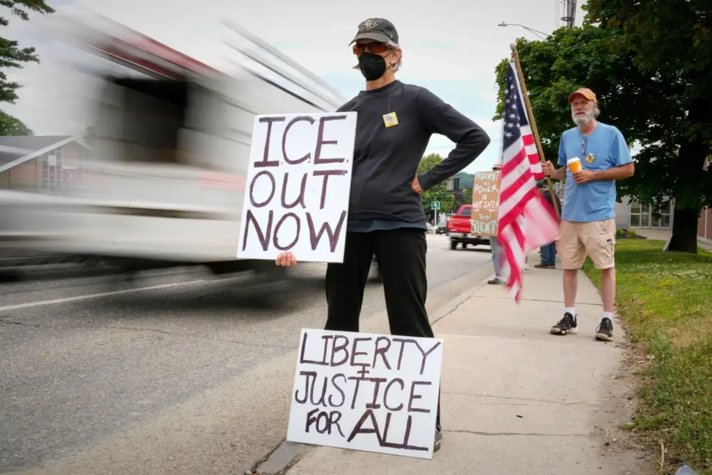 Members of the Capitol Area Indivisible group protest against U.S....