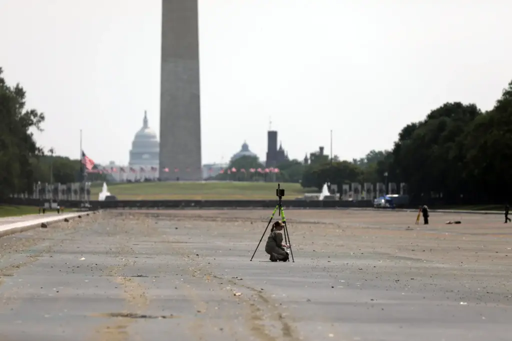 National Park Service workers investigate the Lincoln Memorial Reflecting Pool...