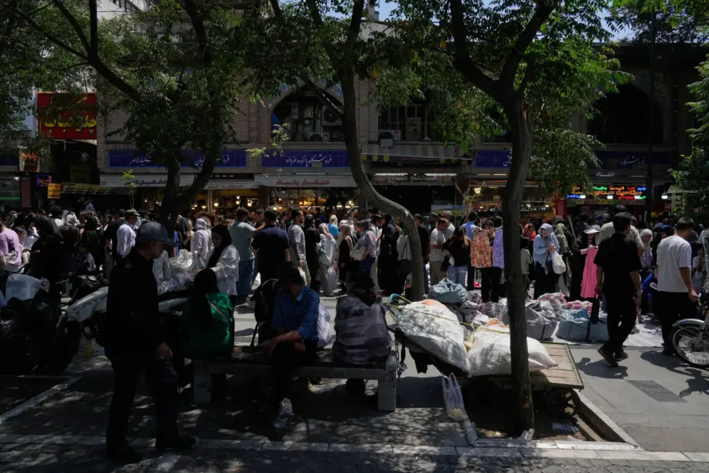People walk around Tehran's traditional main bazaar.