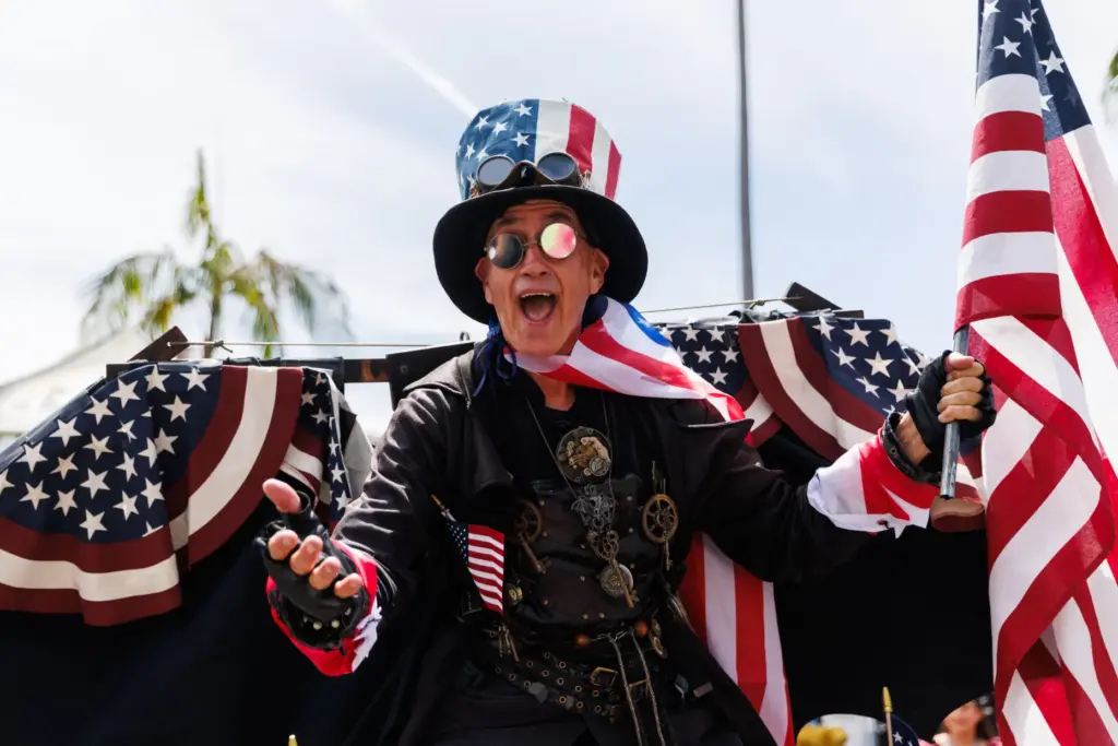 A man dressed in an American-themed steampunk outfit poses during...