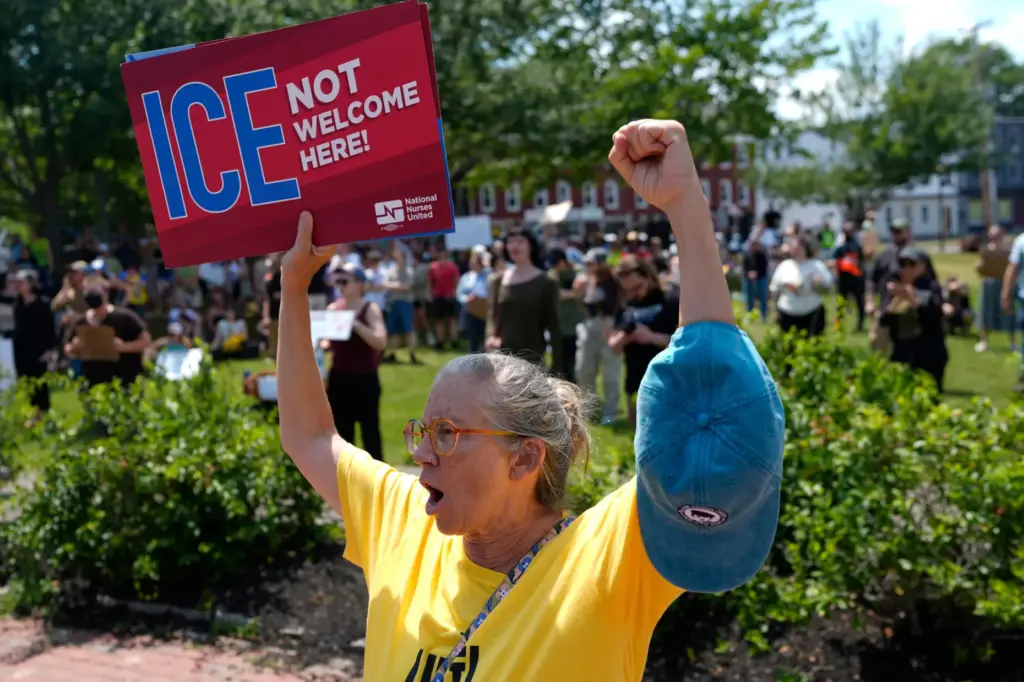 Protesters gather at a park near the scene of a fatal shooting involving ICE.