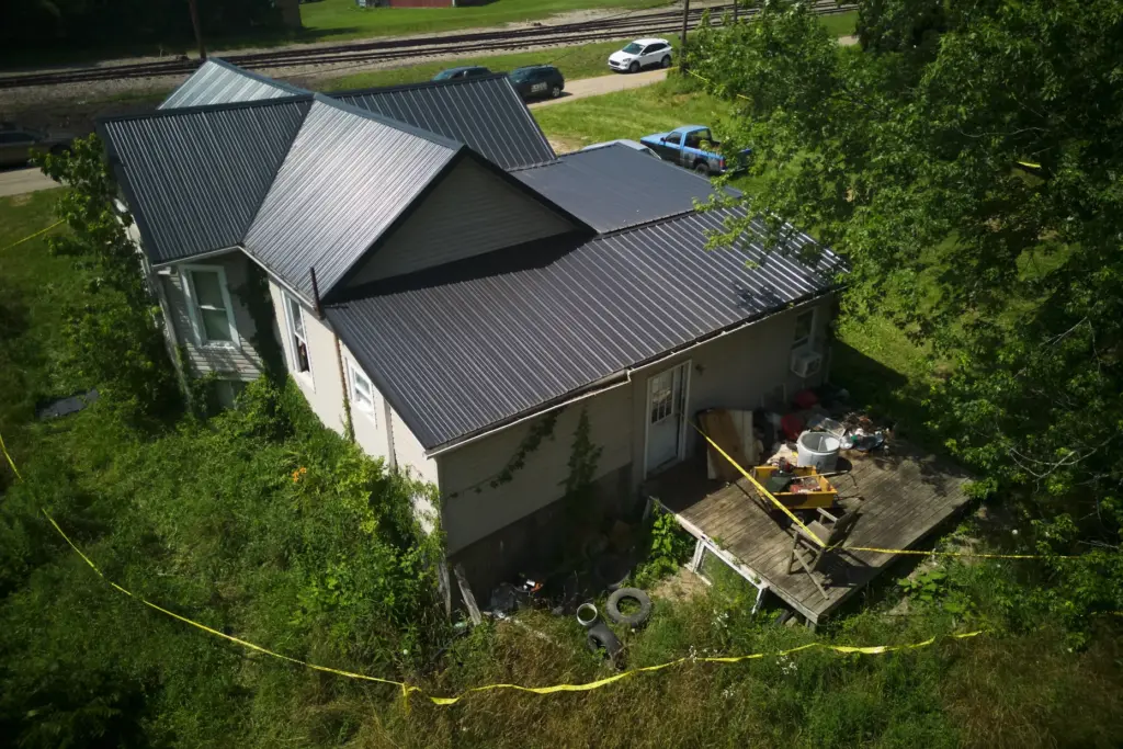 Police tape surrounds a home where authorities say they removed...