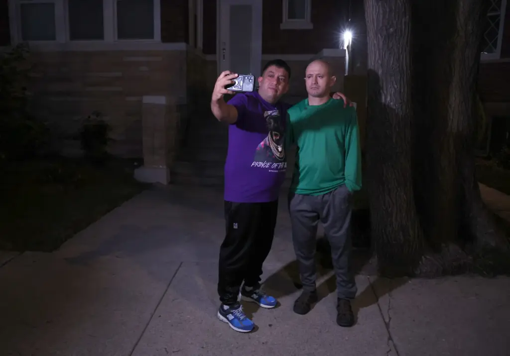 Alfredo Pacheco, left, takes a selfie with his brother, JosÃ©...