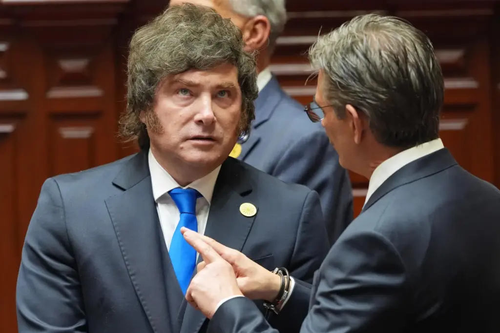 Argentina’s President Javier Milei, left, talks to Bolivia’s President Rodrigo...