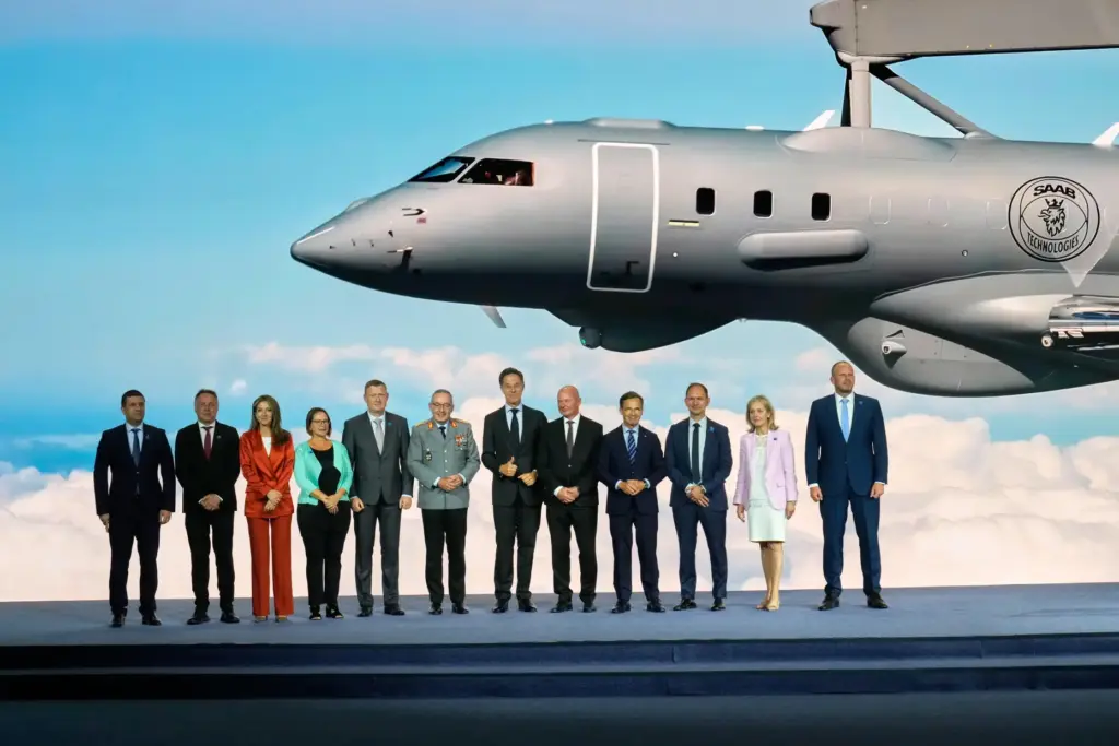 NATO Secretary General Mark Rutte, center, poses with NATO defense...