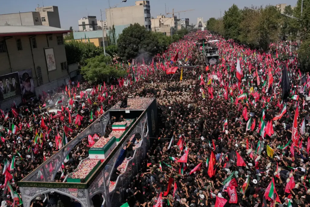 A truck carries the coffins of Iranian Supreme Leader Ayatollah Ali Khamenei and his family.