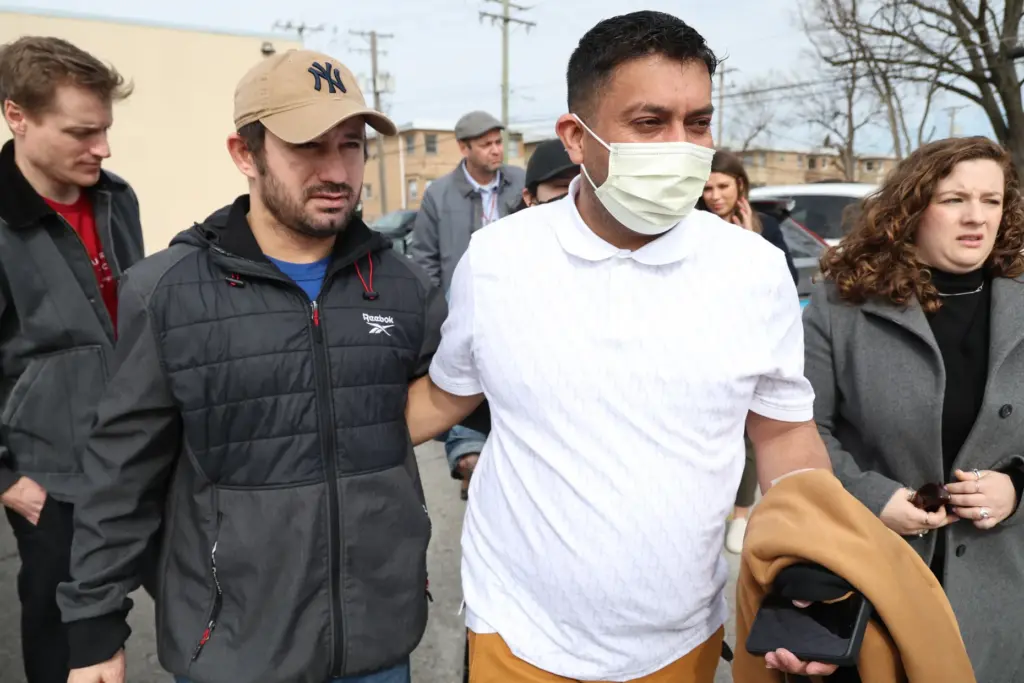 Alfredo Pacheco, right, of Cicero, walks with his reunites brother...