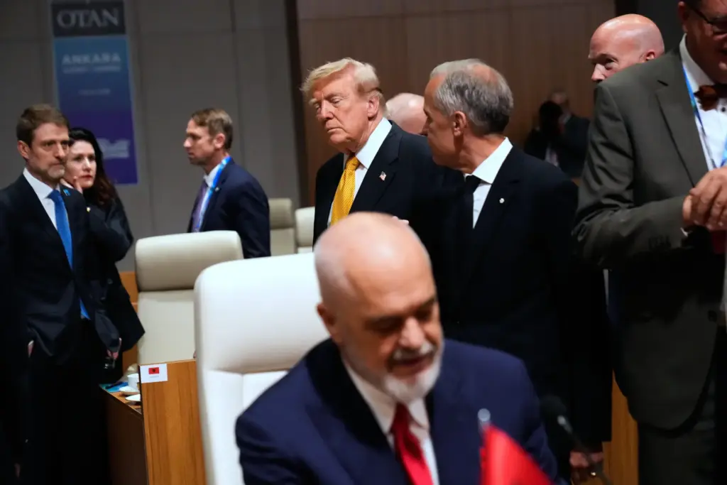 President Donald Trump, center left, speaks with Canada’s Prime Minister...