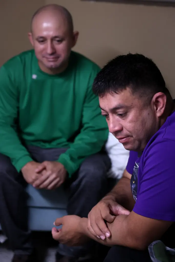 Brothers JosÃ© Gregorio Gonzalez, left, and Alfredo Pacheco, wait in...