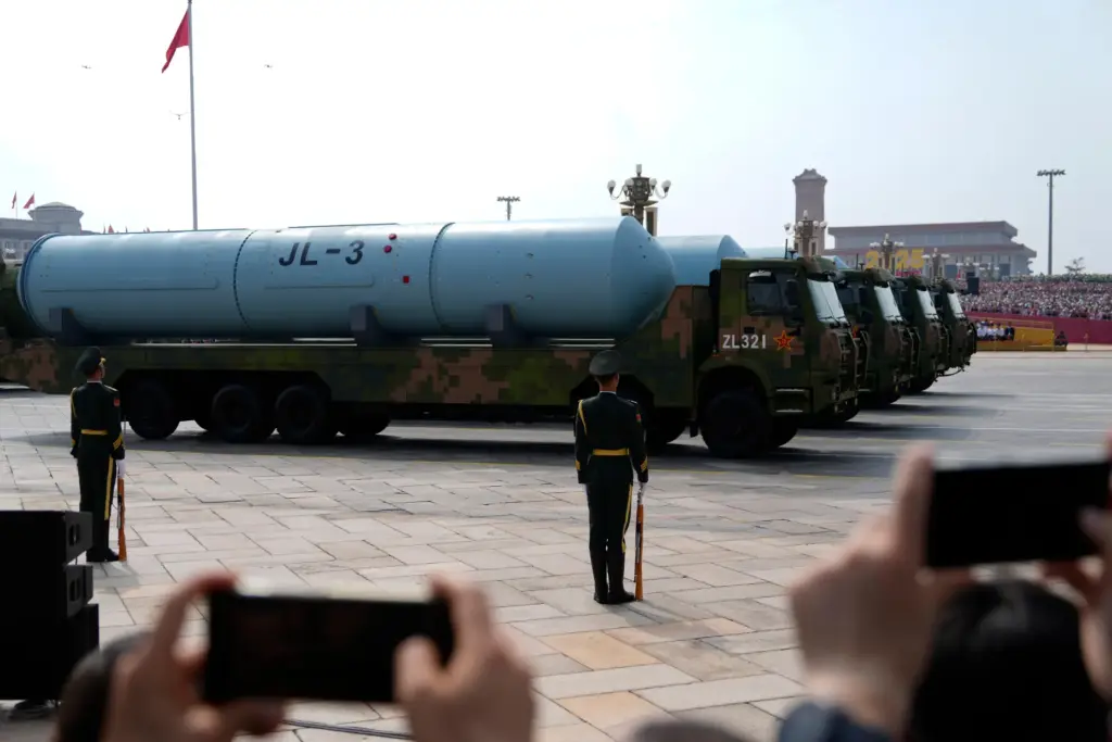 Chinese military vehicles carrying JL-3 submarine-launched missiles on armoured vehicles.