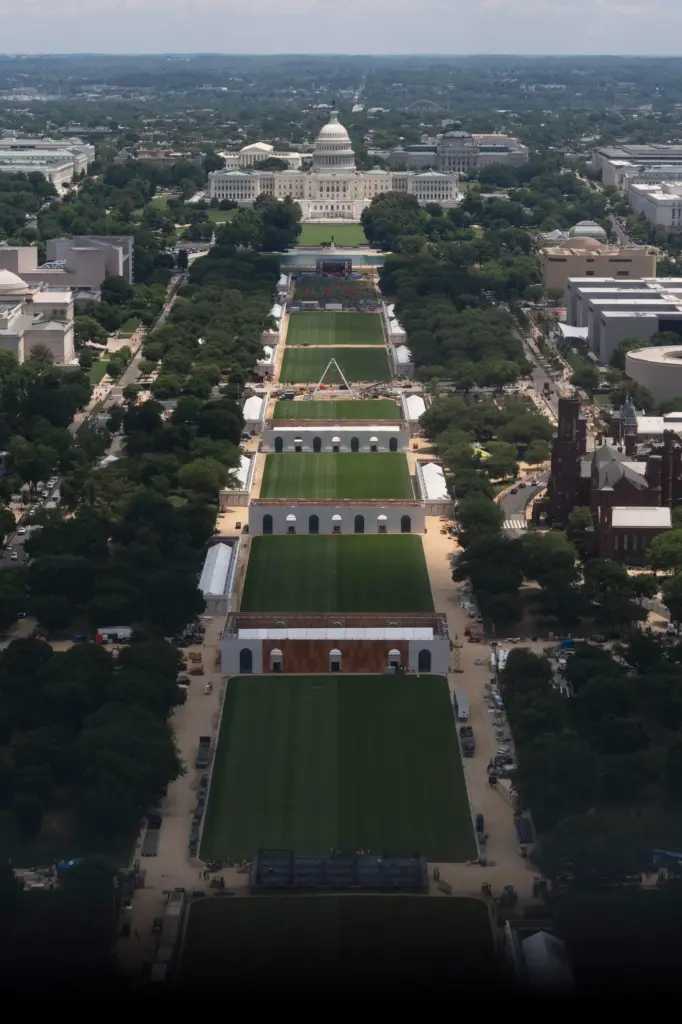 Construction crews continue building structures on the National Mall near...