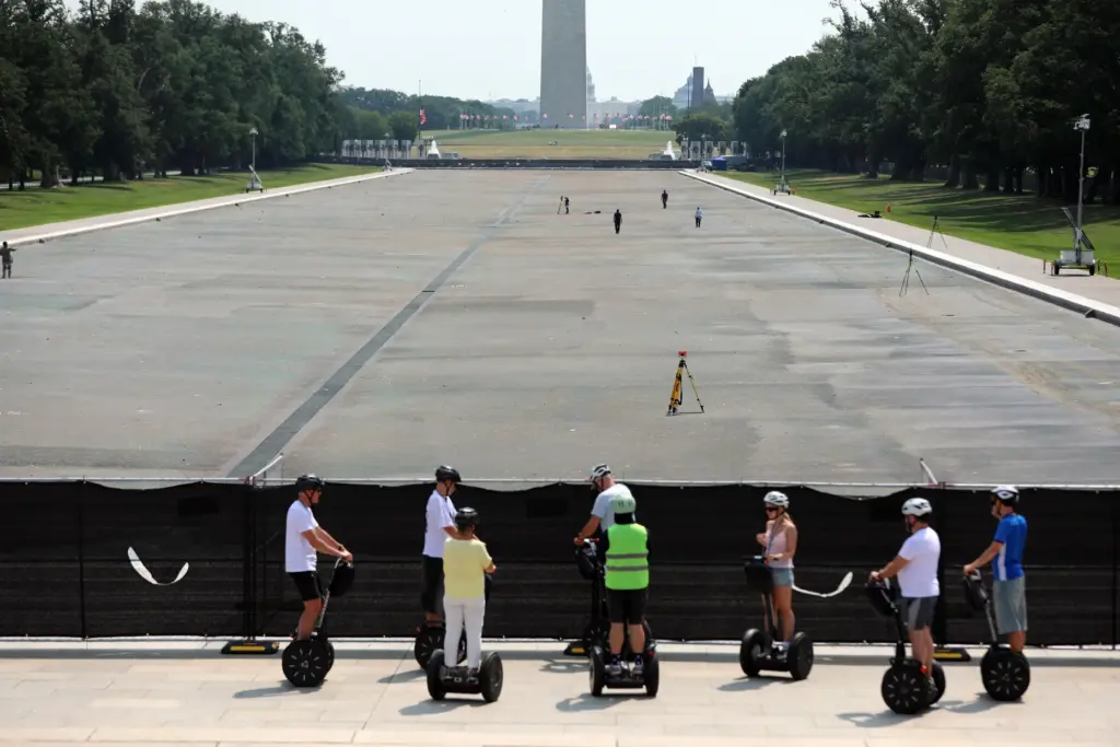 The Reflecting Pool, Washington Monument and U.S. Capitol are seen,...