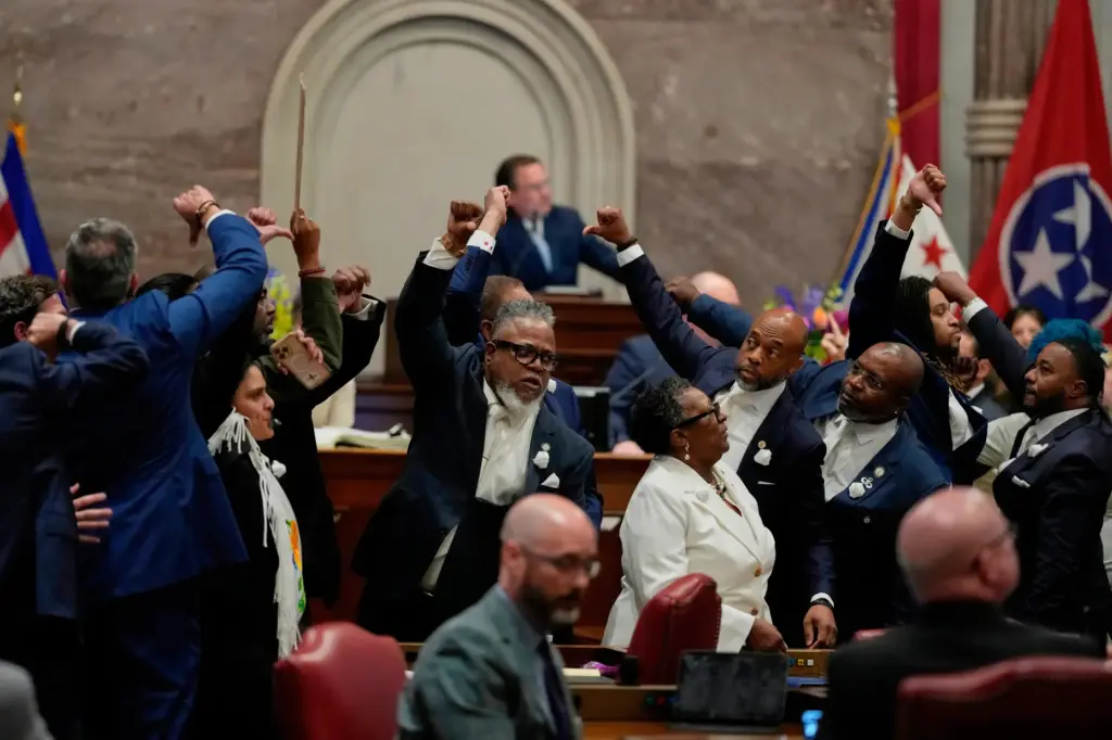 House Democrats gesture on the chamber floor.