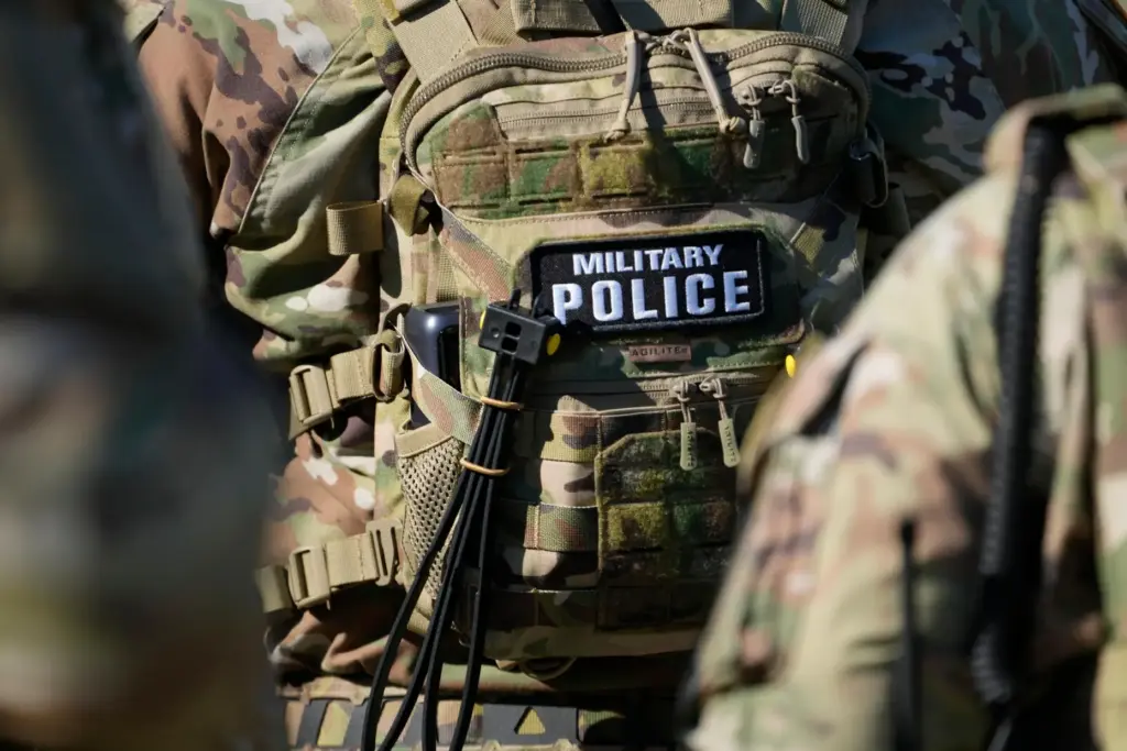 FILE – Members from the National Guard working as part...