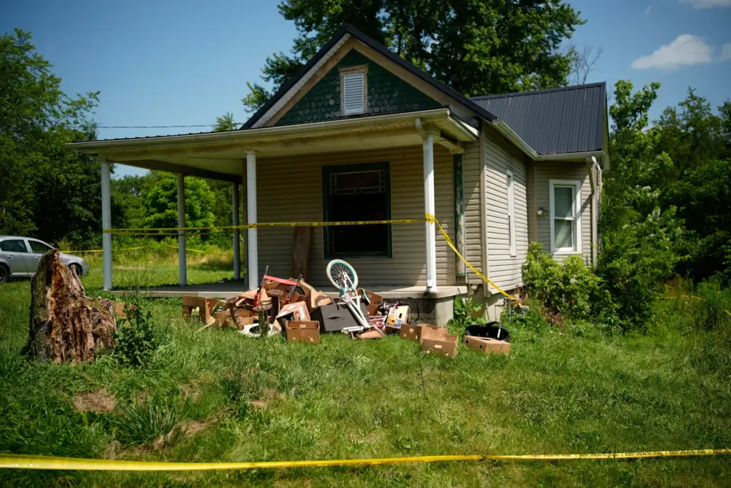 Police tape surrounds a home where authorities say they removed...
