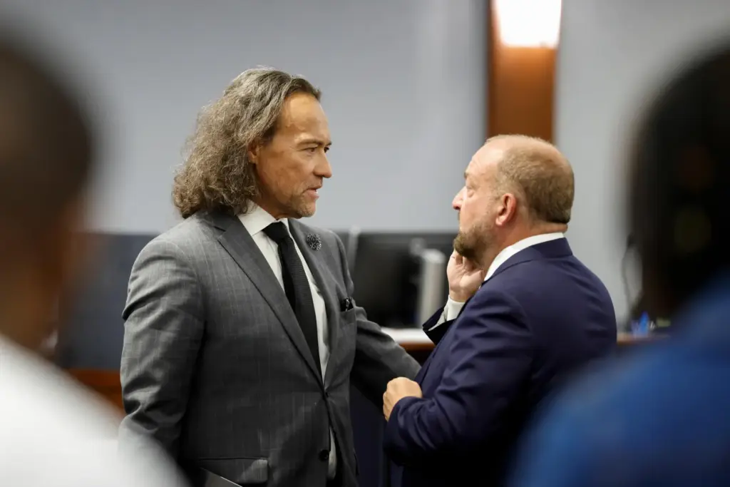 Defense attorney Michael Sanft, left, and Chief Deputy District Attorney...