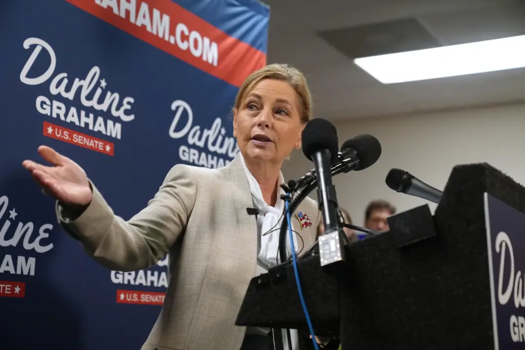 Sen. Darline Graham, R-S.C., gestures to Gov. Henry McMaster, R-S.C.,...