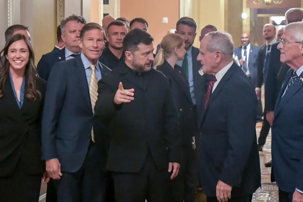 Ukraine President Volodymyr Zelenskyy is joined by a group of senators.