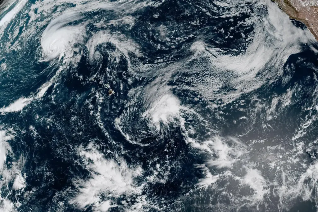 This satellite image released by NOAA shows Hurricane Lala, upper...