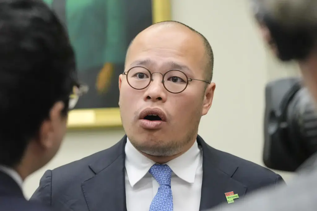 Sebastien Lai speaks with reporters after a Congressional Executive Commission...