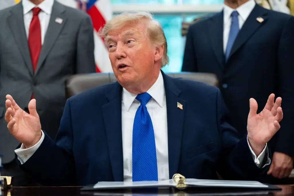 President Donald Trump speaks in the Oval Office of the...